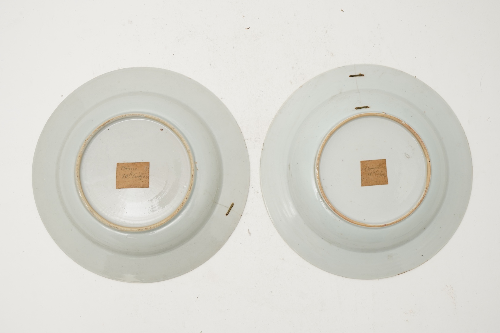 A pair of Chinese famille armorial plates, Qianlong, c.1750
